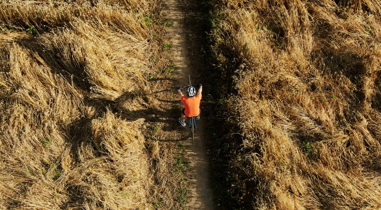 Aerial Shot of Travel By Drone Team Member Testing a Tracking Drone