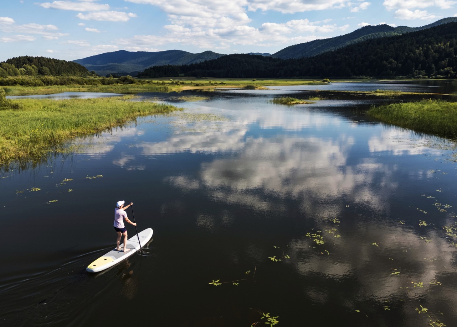 Drone Shot of Travel By Drone Team Member Paddling Stand-UP Board